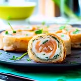 A plate of food with a pastry and a bowl of soup.