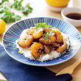 A plate of food with rice and shrimp.