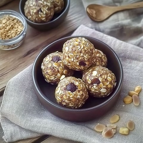 A bowl of energy balls made with oats and nuts.